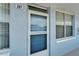 Apartment 207's front door, reflecting the building's exterior and design details at 4895 Bay Ne St # 207, St Petersburg, FL 33703