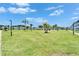 Well-maintained community grounds with mature palm trees and manicured lawn, offering a serene environment at 4895 Bay Ne St # 207, St Petersburg, FL 33703