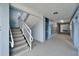 Well-lit hallway leading to stairwell and apartment doors at 4895 Bay Ne St # 207, St Petersburg, FL 33703