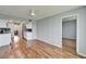 Bright living room features wood floors, ceiling fan, and an open kitchen at 4895 Bay Ne St # 207, St Petersburg, FL 33703