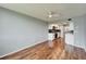 Spacious living room with wood floors, ceiling fan, and an open kitchen at 4895 Bay Ne St # 207, St Petersburg, FL 33703