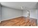 Spacious living room with hard wood floors and a ceiling fan providing a comfortable atmosphere at 4895 Bay Ne St # 207, St Petersburg, FL 33703