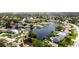 Aerial view of waterfront homes, lush trees, and deep canal at 5101 Dover Ne St, St Petersburg, FL 33703