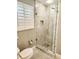 Bathroom boasts glass shower stall with tiled walls at 5101 Dover Ne St, St Petersburg, FL 33703