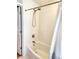A bathtub and shower with white tile walls and a neutral-colored shower curtain at 5101 Dover Ne St, St Petersburg, FL 33703
