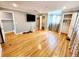 Spacious bedroom features hardwood floors, closet, and large TV at 5101 Dover Ne St, St Petersburg, FL 33703