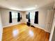 Bedroom with hardwood floors, recessed lighting, and two windows at 5101 Dover Ne St, St Petersburg, FL 33703
