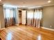 Spacious bedroom features hardwood floors, closet, and two windows at 5101 Dover Ne St, St Petersburg, FL 33703