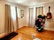 An empty bedroom with hardwood floors, natural light and neutral-colored walls at 5101 Dover Ne St, St Petersburg, FL 33703