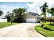 Driveway to a two-car garage of a well-maintained home with lush landscaping and a basketball hoop at 5101 Dover Ne St, St Petersburg, FL 33703