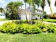 Front exterior showcasing well-maintained lawn and landscape at 5101 Dover Ne St, St Petersburg, FL 33703