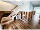 Image shows the living room with new tile flooring, exposed framing and staircase at 5101 Dover Ne St, St Petersburg, FL 33703