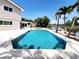 A full pool and canal view from the home's backyard at 5101 Dover Ne St, St Petersburg, FL 33703
