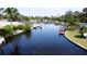 Scenic waterfront view featuring deep water canal, docks and lush tropical landscaping at 5101 Dover Ne St, St Petersburg, FL 33703