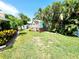The backyard is complete with playhouse at 5101 Dover Ne St, St Petersburg, FL 33703