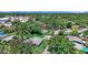 Aerial view of the home with mature trees, close to commercial developments and the bay at 5119 23Rd S Ave, Gulfport, FL 33707