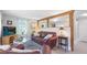Bright living room featuring wood beams, comfortable seating, and a serene atmosphere at 5119 23Rd S Ave, Gulfport, FL 33707