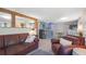 Comfortable living room features rustic wooden accents, cozy leather sofas, and open access to the kitchen at 5119 23Rd S Ave, Gulfport, FL 33707
