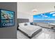 Bright bedroom with a large window overlooking the water, a comfortable bed, and a desk area at 5153 Isla Key S Blvd # 415, St Petersburg, FL 33715