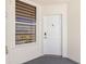 Exterior entryway showcasing a secure door, modern hardware, and a bright window at 5153 Isla Key S Blvd # 415, St Petersburg, FL 33715