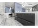 Modern kitchen with black and white cabinets, stainless steel appliances, and large island at 5153 Isla Key S Blvd # 415, St Petersburg, FL 33715