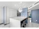 Modern kitchen with white cabinets, large island with seating, and stainless steel appliances at 5153 Isla Key S Blvd # 415, St Petersburg, FL 33715