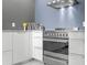 Close-up of a modern kitchen with stainless steel appliances and white cabinets at 5153 Isla Key S Blvd # 415, St Petersburg, FL 33715