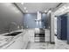 Modern kitchen with white cabinets, marble countertops, and stainless steel appliances, perfect for culinary enthusiasts at 5153 Isla Key S Blvd # 415, St Petersburg, FL 33715