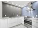 Bright kitchen featuring modern appliances, marble countertops, and ample cabinet space for storage at 5153 Isla Key S Blvd # 415, St Petersburg, FL 33715