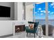 Inviting living room featuring marble fireplace and cozy seating with expansive water views at 5153 Isla Key S Blvd # 415, St Petersburg, FL 33715