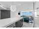 An open-concept layout features modern kitchen, dining, and living areas with expansive windows offering breathtaking water views at 5153 Isla Key S Blvd # 415, St Petersburg, FL 33715