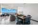 Bright living and dining space featuring modern decor, elegant furniture, and stunning water views at 5153 Isla Key S Blvd # 415, St Petersburg, FL 33715