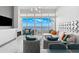 Bright living room with fireplace, ample seating, floor-to-ceiling windows and a waterfront view at 5153 Isla Key S Blvd # 415, St Petersburg, FL 33715