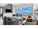 Bright living room with fireplace, ample seating, floor-to-ceiling windows and a waterfront view at 5153 Isla Key S Blvd # 415, St Petersburg, FL 33715