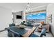 Open-concept living and dining area with modern furnishings and floor-to-ceiling windows offering beautiful views at 5153 Isla Key S Blvd # 415, St Petersburg, FL 33715