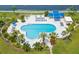 Aerial shot of a pool area showcasing blue canopies, lush trees, and plenty of seating at 5153 Isla Key S Blvd # 415, St Petersburg, FL 33715
