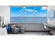 Comfortable sitting area overlooking water view and desk in main bedroom at 5153 Isla Key S Blvd # 415, St Petersburg, FL 33715