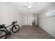 This bedroom has a ceiling fan, wood-look tile floor, and closet for tidy storage at 520 34Th N Ave, St Petersburg, FL 33704