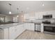 Stylish kitchen with white cabinets, granite countertops, and stainless steel appliances at 520 34Th N Ave, St Petersburg, FL 33704