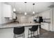 Modern kitchen featuring granite countertops, stainless steel appliances, and a breakfast bar at 520 34Th N Ave, St Petersburg, FL 33704