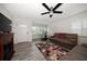 Bright living room with wood-look tile, fireplace, and comfortable seating arrangement at 520 34Th N Ave, St Petersburg, FL 33704