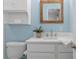 Bathroom with a toilet, vanity, and light blue painted walls at 529 59Th S Way, St Petersburg, FL 33707