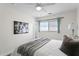 Bright bedroom featuring a large bed, window, and modern decor at 529 59Th S Way, St Petersburg, FL 33707