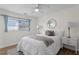 Cozy bedroom featuring a comfortable bed, side tables, and a window at 529 59Th S Way, St Petersburg, FL 33707