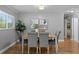 Inviting dining room featuring a wooden table, upholstered chairs, and natural light at 529 59Th S Way, St Petersburg, FL 33707