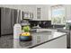 Lovely kitchen featuring granite countertops, stainless appliances, and decorative accents at 529 59Th S Way, St Petersburg, FL 33707