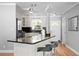 Spacious kitchen with granite countertops, stainless appliances, and bar seating at 529 59Th S Way, St Petersburg, FL 33707