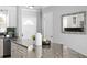 Stylish kitchen with granite counters, stainless appliances, and an open layout at 529 59Th S Way, St Petersburg, FL 33707