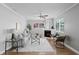 Bright living room with a fireplace, ceiling fan, and cozy seating arrangement at 529 59Th S Way, St Petersburg, FL 33707