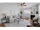 Bright living room featuring fireplace, ceiling fan, and comfortable sofa at 529 59Th S Way, St Petersburg, FL 33707